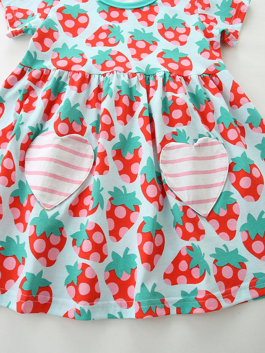 Toddler cotton dress with strawberry print and heart pockets.