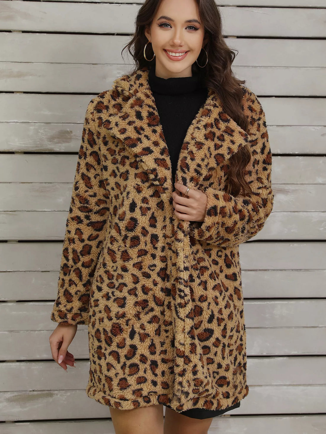 Cozy fuzzy teddy wrap coat in leopard print with a shawl collar.