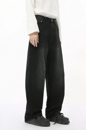 Oversized baggy wash denim trousers in dark wash, with a relaxed fit and wide leg.
