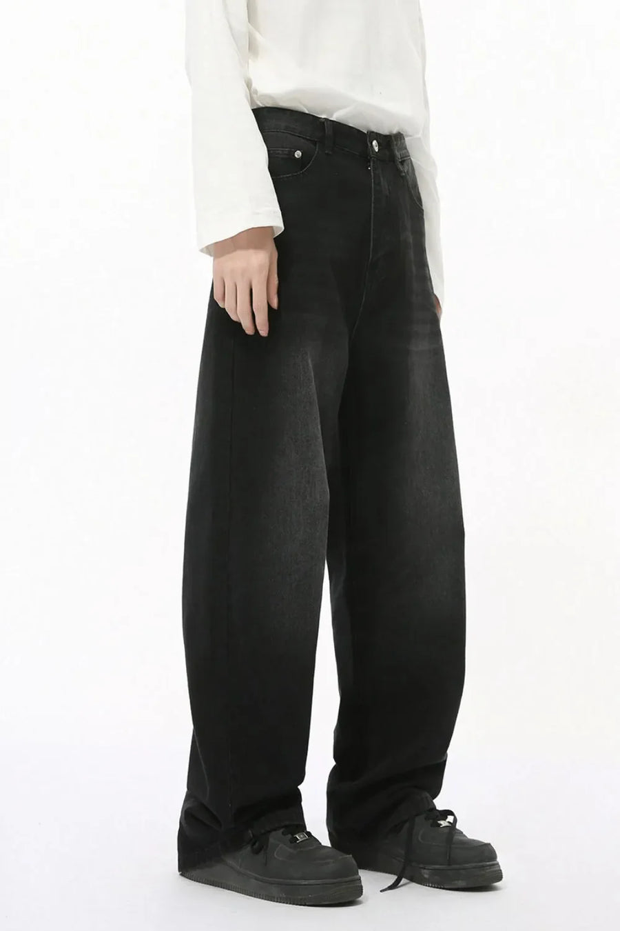 Oversized baggy wash denim trousers in dark wash, with a relaxed fit and wide leg.