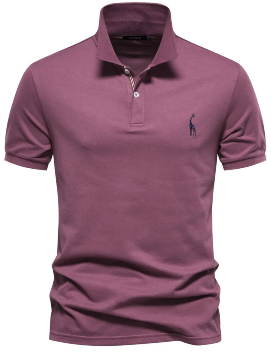 Deep purple piqué polo shirt with giraffe embroidery and button placket.