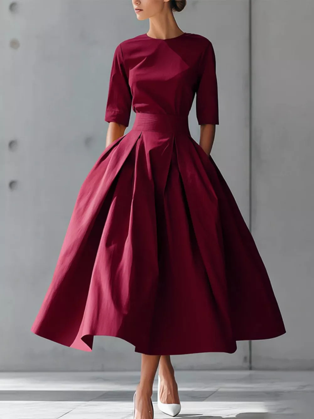 Burgundy A-line midi dress with pleated skirt, short sleeves, and pockets.