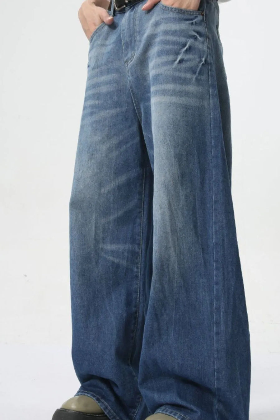 Oversized denim palazzo trousers in medium wash with a relaxed fit and wide leg.