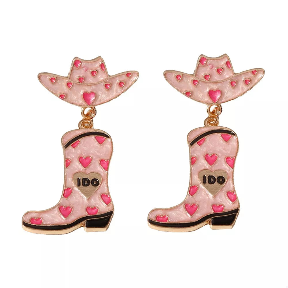 Pink cowgirl hat and boot dangle earrings with heart pattern and "I Do" detail.