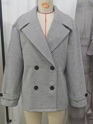 Light gray double-breasted wool blend pea coat with black buttons and cuffed sleeves.