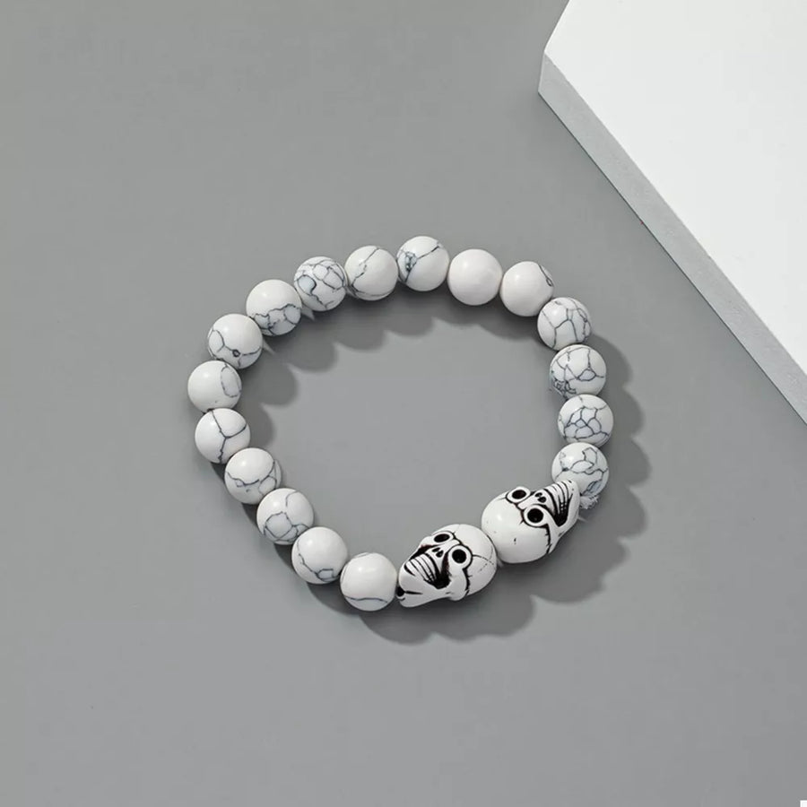 black bracelet featuring beaded and skull motif