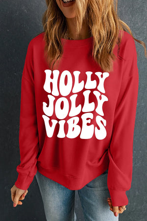 Red crewneck sweatshirt with white "HOLLY JOLLY VIBES" graphic print