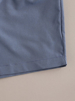 Toddler outfit set in royal blue cotton, showing hem detail