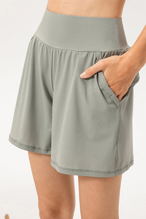 Sage active shorts with elastic waistband and pockets.