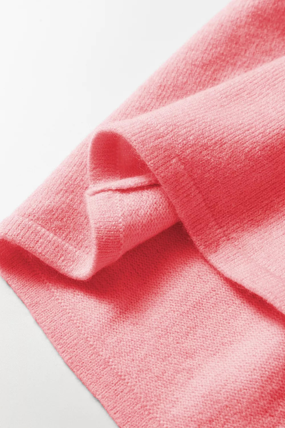 Pink acrylic knit cardigan with button front detail