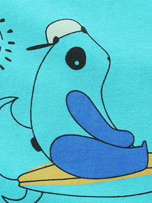 Aqua t-shirt with playful cartoon character wearing a hat and sitting on a surfboard.