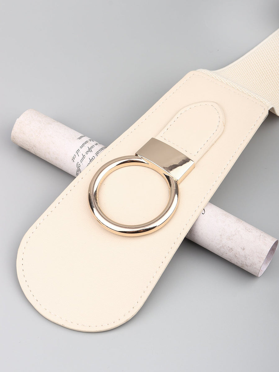 Cream elastic belt with sculpted faux leather panel and gold ring buckle.