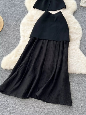 Black sheer two-piece set with button details, textured skirt