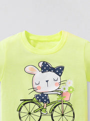 Yellow cotton crew neck t-shirt with a graphic of a bunny riding a bicycle with a flower basket.