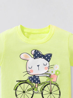 Yellow cotton crew neck t-shirt with a graphic of a bunny riding a bicycle with a flower basket.