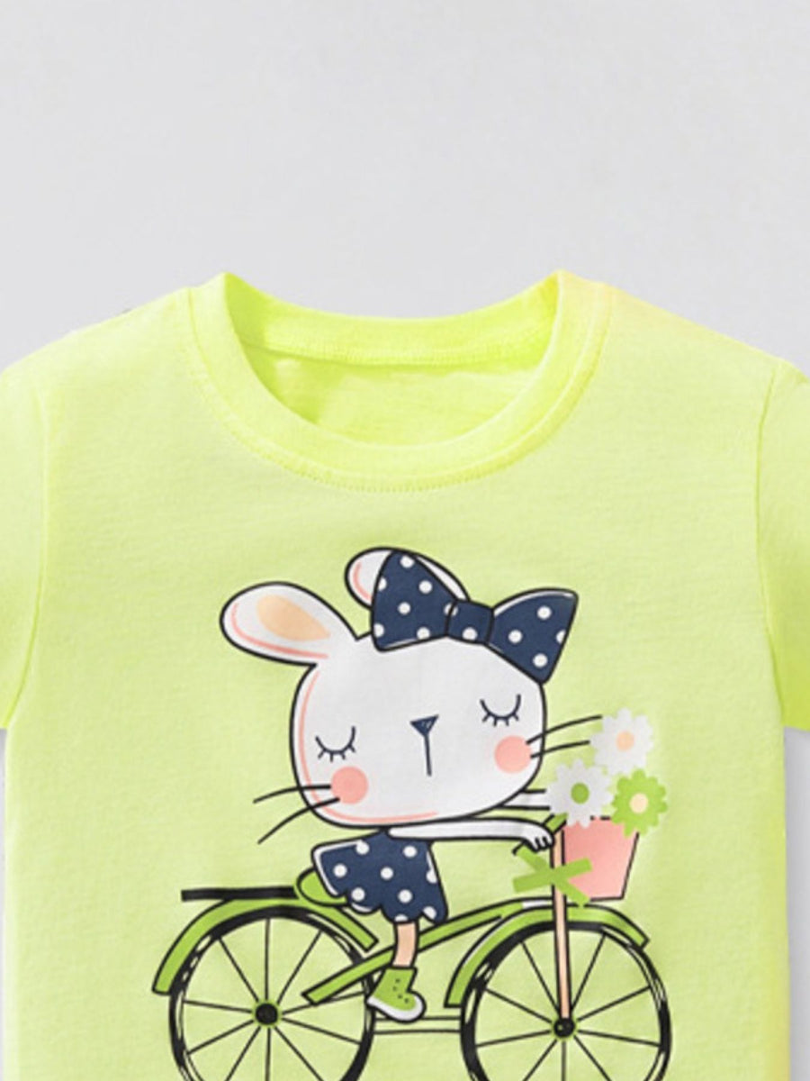 Yellow cotton crew neck t-shirt with a graphic of a bunny riding a bicycle with a flower basket.
