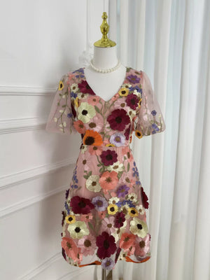 Sheer pink floral embroidered mini dress with v-neck and short sleeves