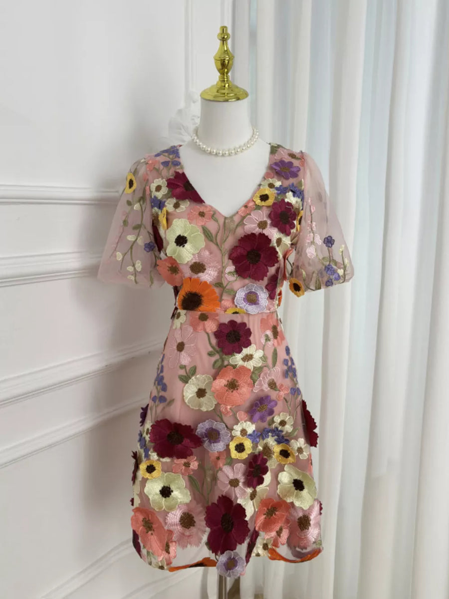 Sheer pink floral embroidered mini dress with v-neck and short sleeves