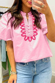 Pink cotton shirt with puff sleeves and embroidered neckline detail
