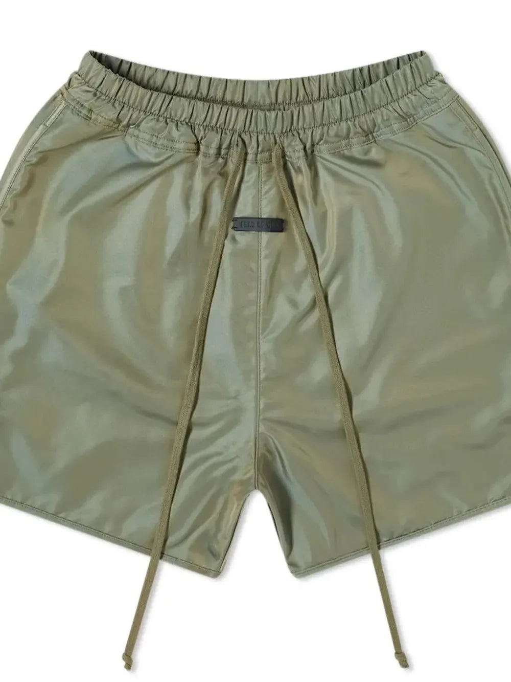 Matcha green nylon drawstring shorts with curved hem detail and elastic waistband.