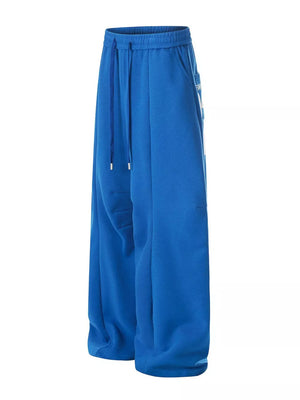 95%polyester, 5%spandex Care instructions: Machine wash cold sweatpants in Blue with wide-leg silhouette