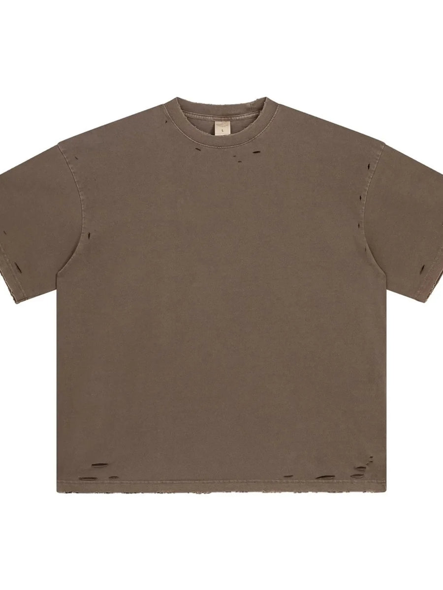 Distressed oversized cotton tee in coffee brown with raw hem and ripped details.