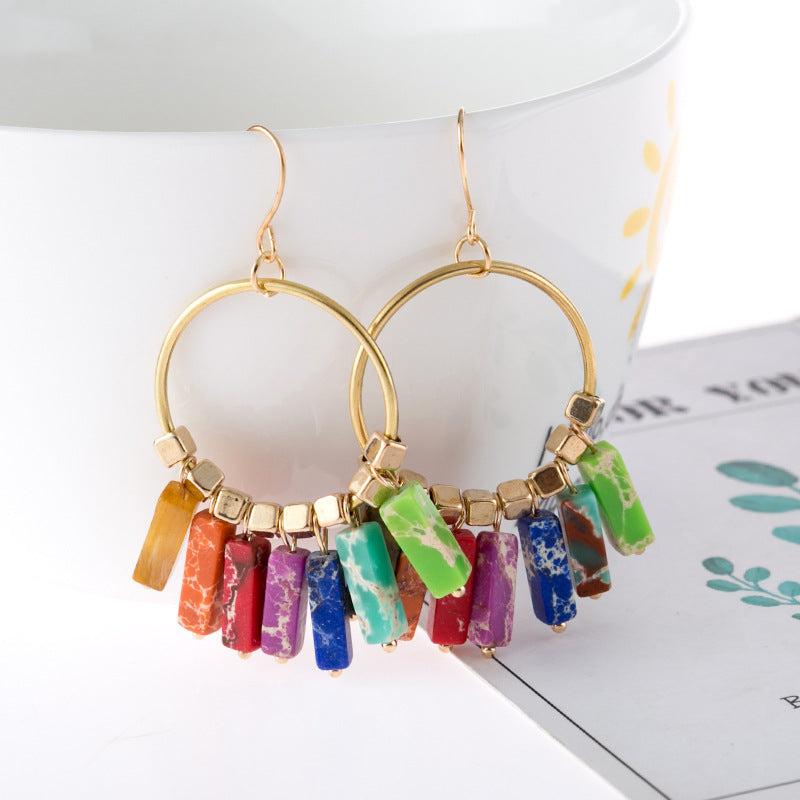 Multicolor stone hoop earrings with gold-tone metal and cube beads.
