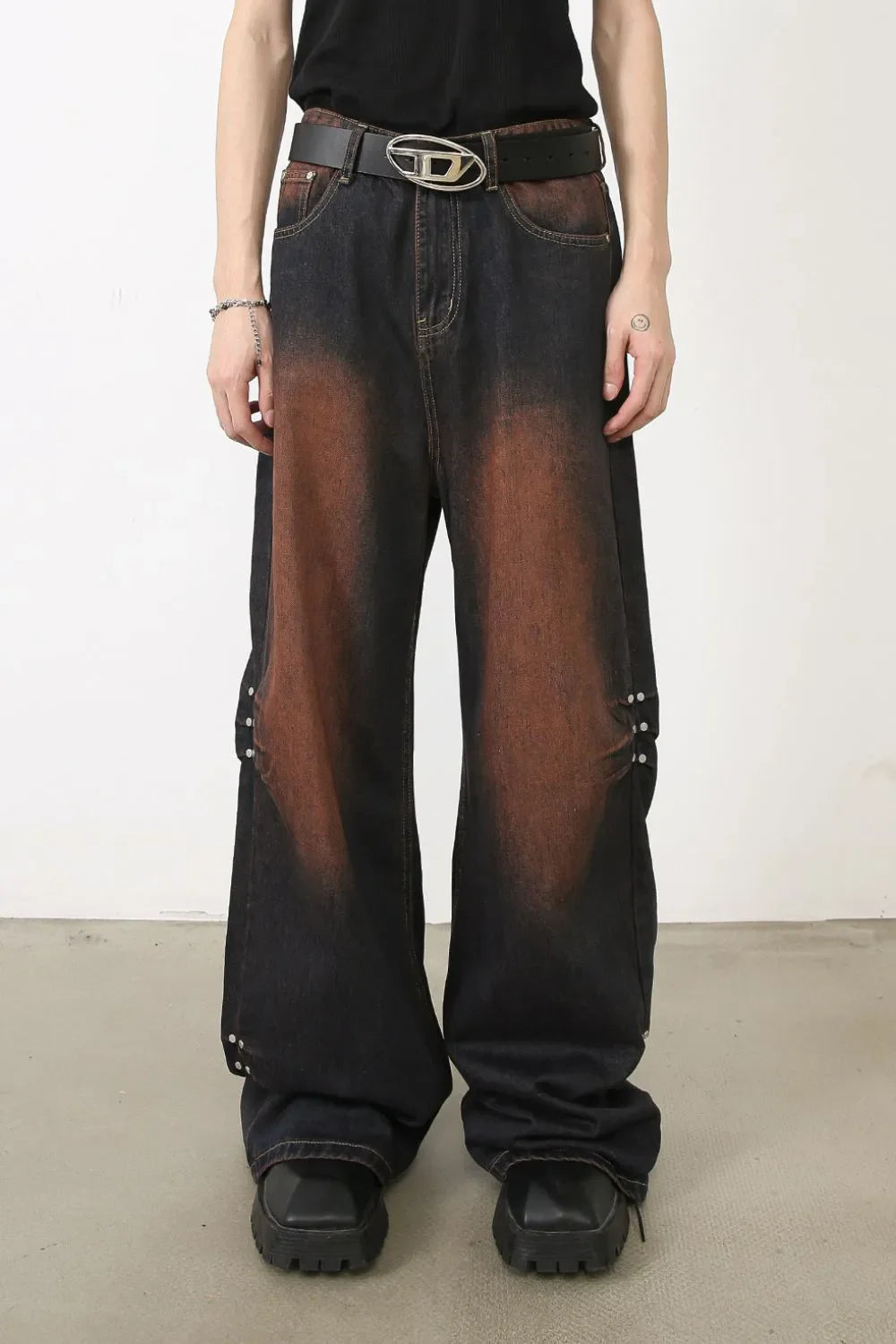 Faded wash palazzo jeans in dark denim with stud details and wide leg.