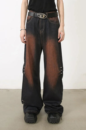 Faded wash palazzo jeans in dark denim with stud details and wide leg.