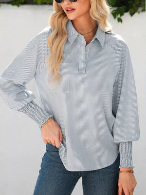 Striped button-up shirt with smocked cuffs and a chest pocket.