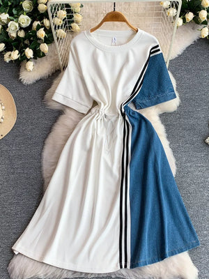 White and denim color block casual dress with drawstring and stripe detail.