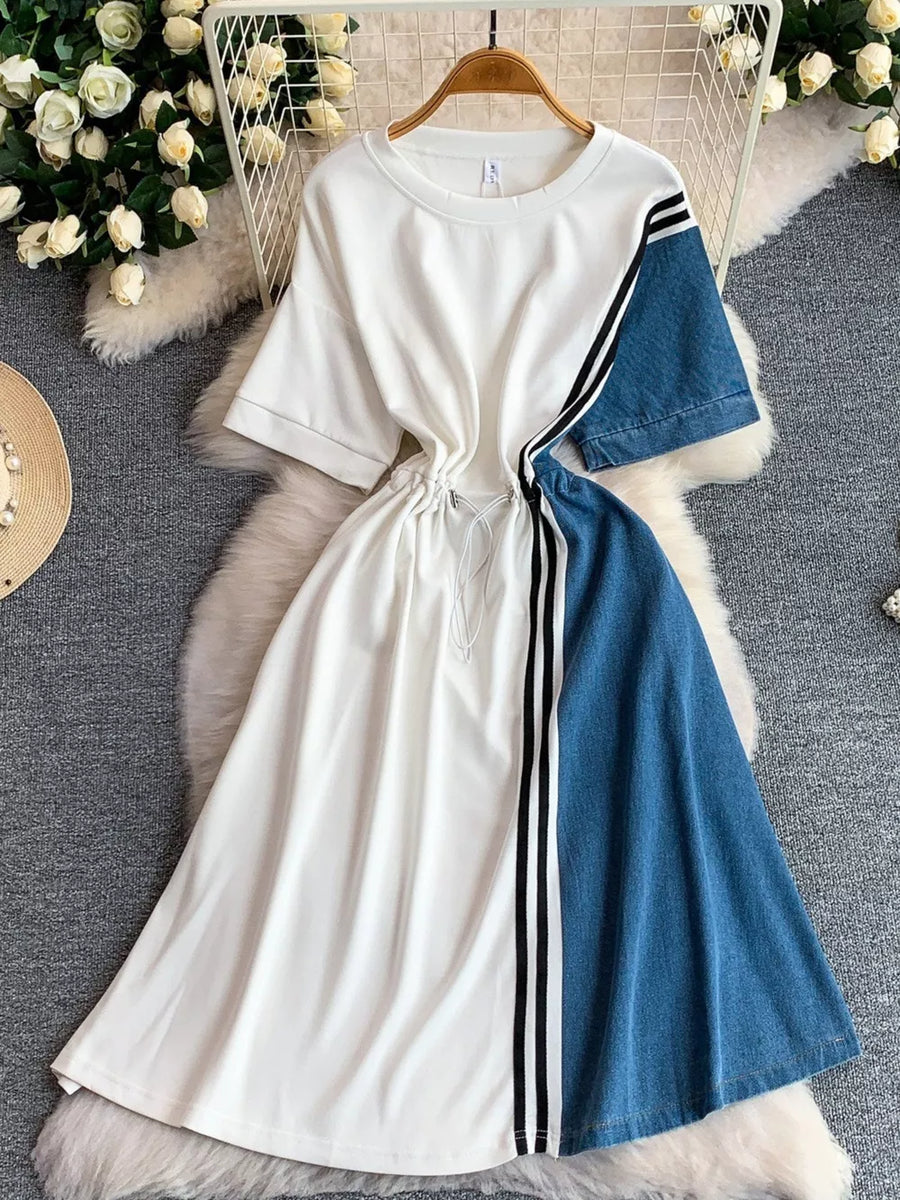 White and denim color block casual dress with drawstring and stripe detail.