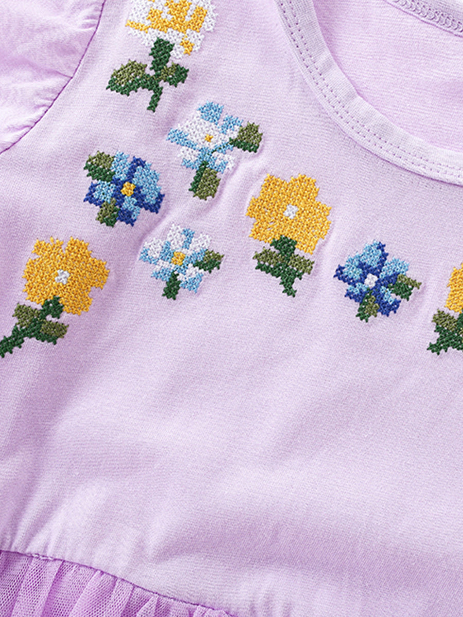 Toddler dress with floral embroidery on lavender cotton, featuring a round neckline and tulle skirt detail.