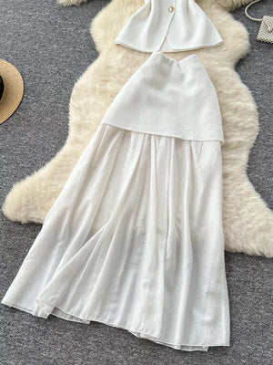 White sheer two-piece set with button details and flowing skirt