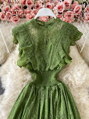 Green lace maxi dress with ruffled sleeves and smocked waist detail