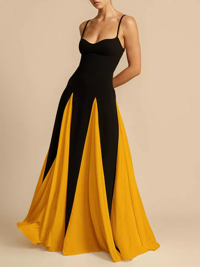 Black and yellow maxi dress with spaghetti straps and paneled skirt