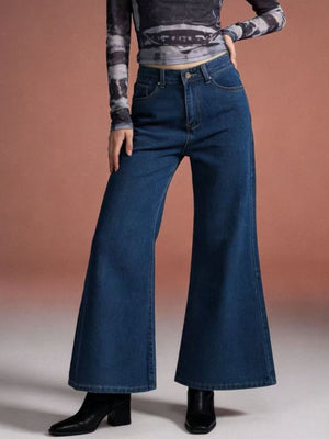 Maternity high-waisted flare jeans in dark wash denim with a comfortable cotton blend fabric.