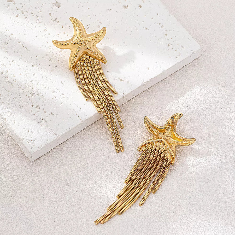 Gold earrings featuring fringe and motif