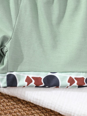 Sage green baby polo and shorts set with camouflage trim detail