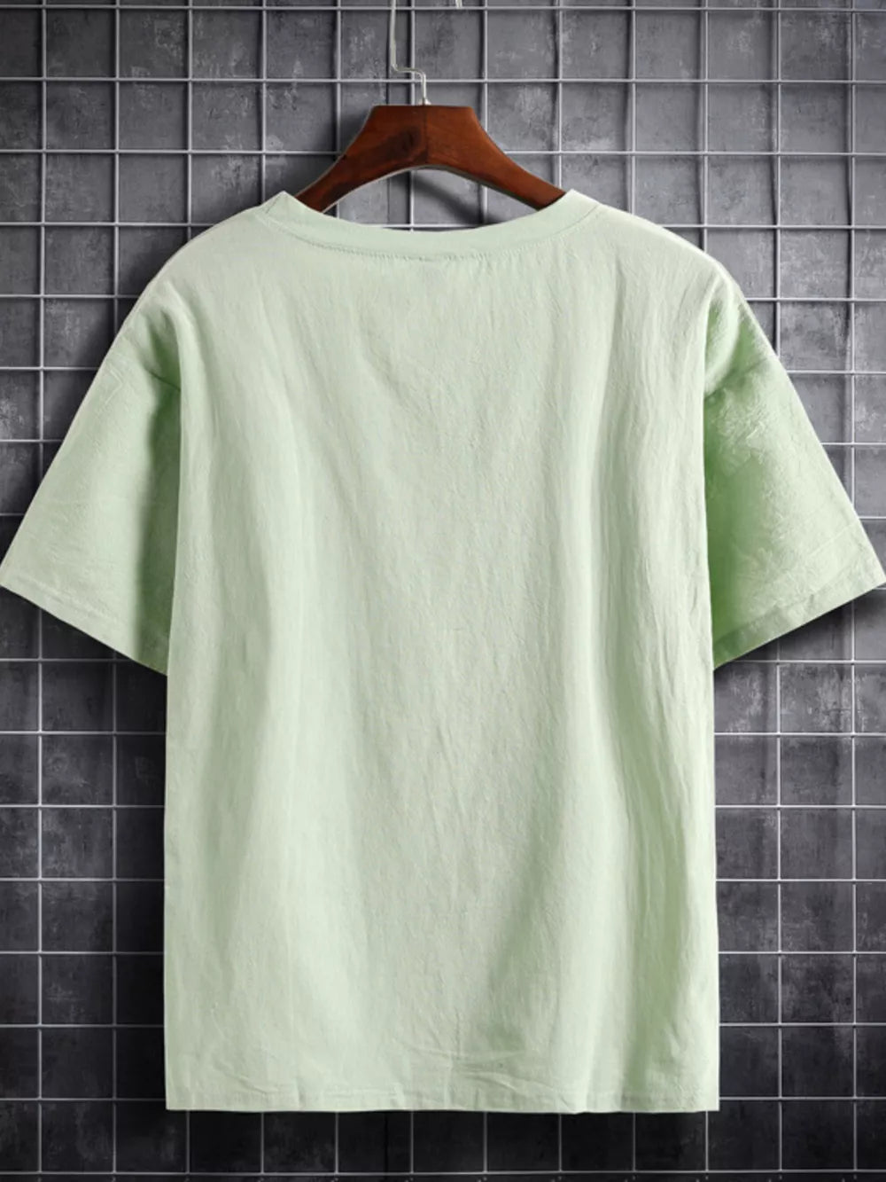 Light green cotton crew neck t-shirt with short sleeves.
