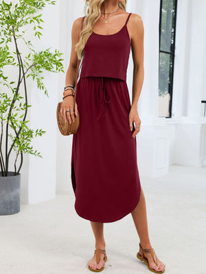 Burgundy scoop neck drawstring midi dress with side slits and spaghetti straps.
