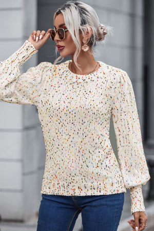 Cream confetti speckle knit sweater with puff sleeves and crew neck.