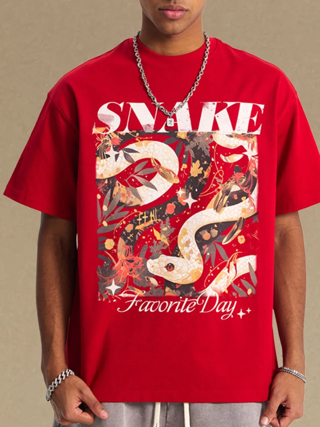 Red oversized graphic tee with snake and floral print, "SNAKE" and "Favorite Day" text.