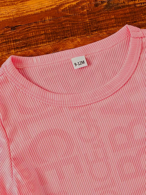 Pink ribbed knit baby tee with crew neck and size tag