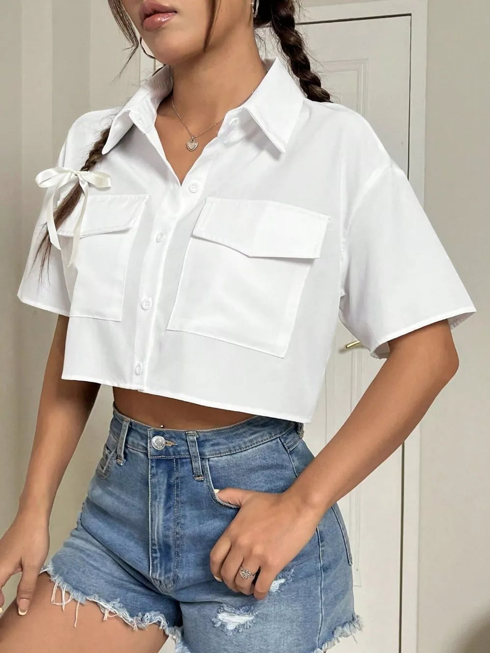 100% polyester Care instructions: Machine wash cold button-up shirt in White with relaxed silhouette