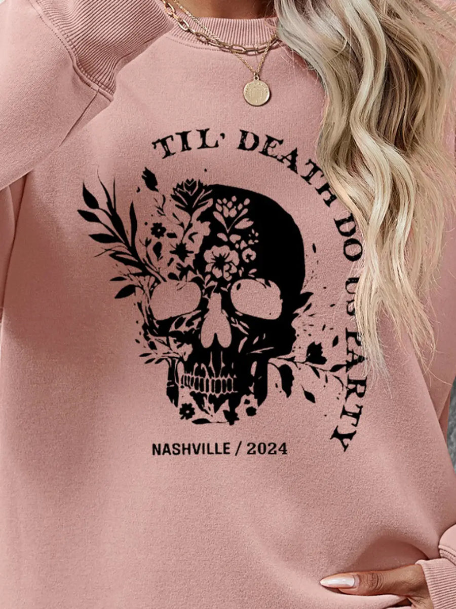 Blush Pink sweatshirt with floral skull graphic and text.