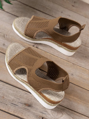 Brown knit cutout espadrille wedge sandals with slingback strap and textured sole.