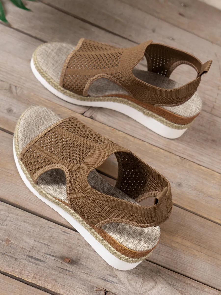 Brown knit cutout espadrille wedge sandals with slingback strap and textured sole.