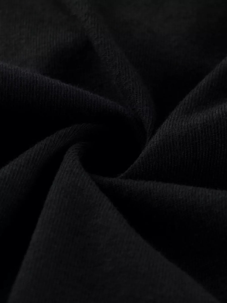 Black ribbed knit fabric with a soft texture.