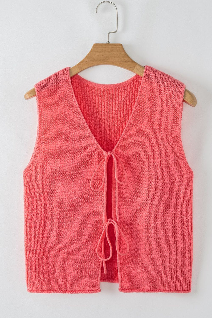 Burnt Coral textured knit tank top with V-neck and tie-front detail.